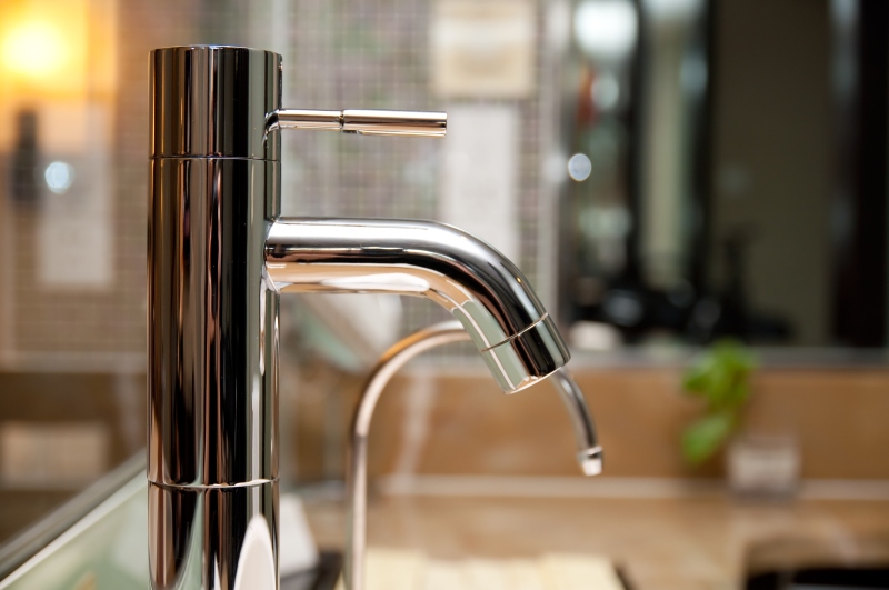 Leaking tap being repaired in West Watford